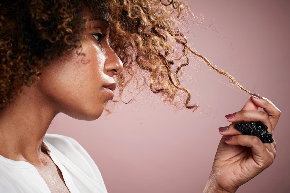 Putting a Sodium Hydroxide Relaxer Under a Hair Dryer for Smoother, Straighter Hair